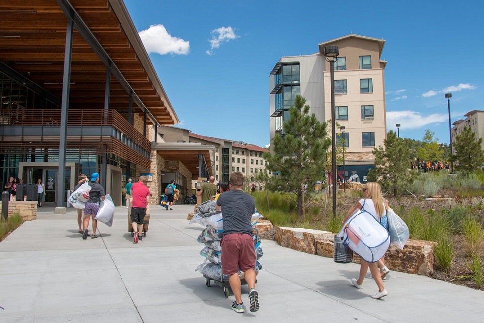 Image of students walking in front of the residence halls